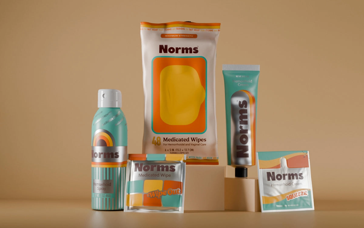 Collection of Norms product packages on a beige background